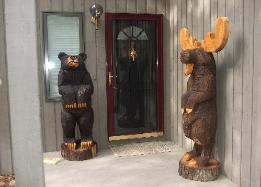 Bear and Moose chainsaw carvings 
